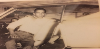 picture of young father in family car